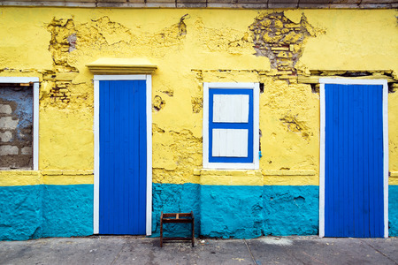Exterior of an old yellow and blue building in Cartagena, Colombiaのeditorial素材