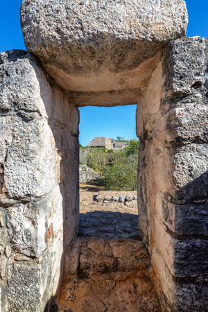 Stone arch in Ek Balam with pyramid visible in the background near Valladolid, Mexicoの写真素材