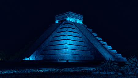 Pyramid of Chichen Itza at night with blue light in Mexicoの写真素材