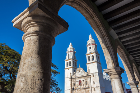 Cathedral in Campeche, Mexico seen through a stone archの写真素材