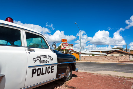 SELIGMAN, AZ - SEPTEMBER 16: Old police car sits on Route 66 in Seligman, AZ on September 16, 2015のeditorial素材