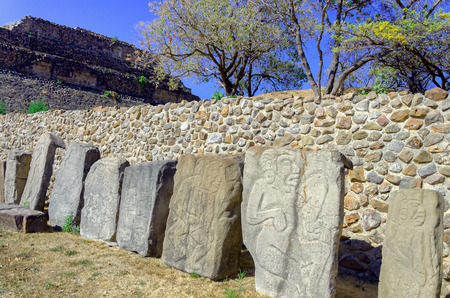 Stones of the dancers in the plaza of the dancers in  Monte Alban ruins in Oaxaca, Mexicoのeditorial素材