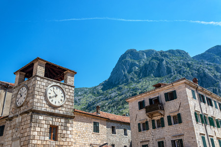 Clock tower and mountains in the historic center of Kotor, Montenegroの写真素材