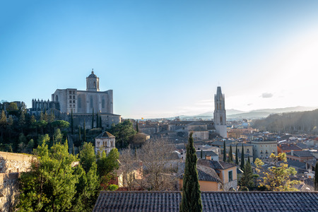 Cityscape of medieval Girona, Spain with the Saint Felix Basilica and Saint Mary's Cathedralの写真素材