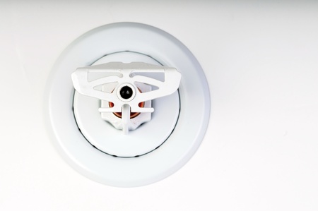 Close up image of fire sprinkler on whiteの写真素材