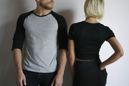young man and young women posing in t-shirtsの写真素材