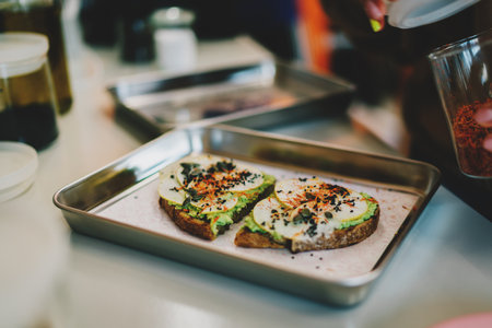 Open sandwich with pumpkin and chia seeds, avocado and pear slices on a multigrain rye bread. Delicious vegetarian food made from natural gluten free ingredients. Healthy and tasty meals for breakfastの写真素材
