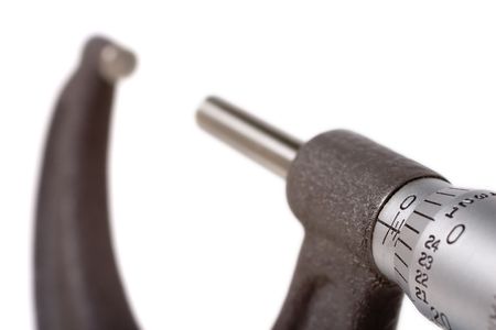 Detail of a micrometer graduations with the tool shown in bokehの写真素材