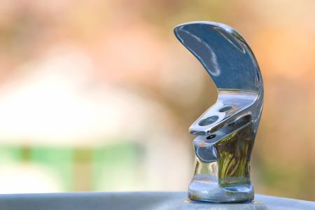 Outdoor drinking fountain with blurred backgroundの写真素材