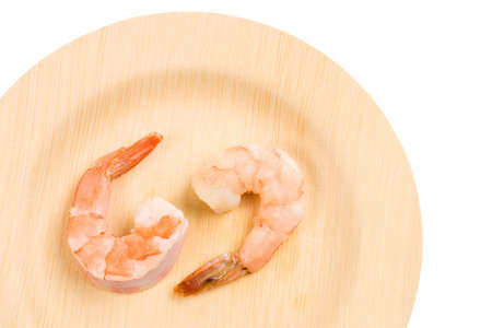 Two cooked Shrimps on an environmentally friendly bamboo plateの写真素材