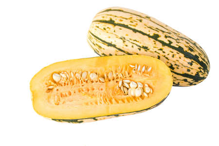A Delicata squash split open to show it's seeds and inner pulpの写真素材