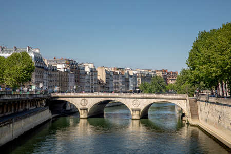 Paris, France - May 6, 2020: Typical Haussmann buildings in the left Seine river side in Paris. There is nobody in the street due to lockdown because of covid-19のeditorial素材