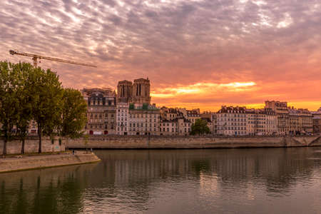 Paris, France - May 7, 2020: Haussmann buildings along the Seine river and Notre Dame cathedral Towers in backgroundのeditorial素材