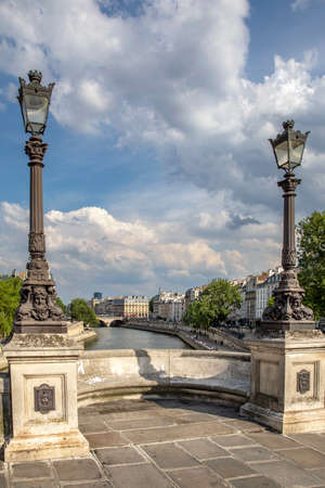 Paris, France - June 3, 2020: Paris cityscape. View from famous Pont Neuf with traditional lamppost. France.のeditorial素材