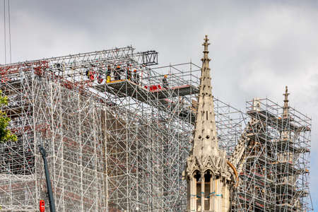 Paris, France - June 9, 2020: Workers begin dismantling the scaffolding, 1 year after the Notre-Dame cathedral fire in Parisのeditorial素材