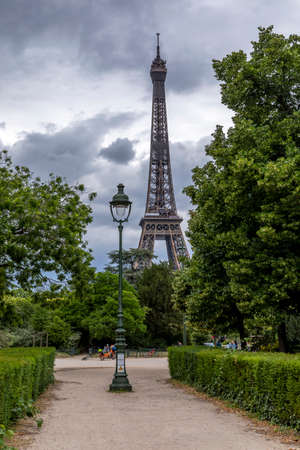 Paris, France - June 10, 2020: Old traditional lamp post pillar with Eiffel Tower in background in Parisのeditorial素材