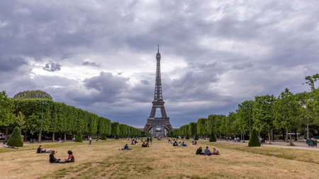 Paris, France - June 10, 2020: Parisians return to relax on the lawns of the Champs de Mars in front of Eiffel tower after the lockdown due to covid-19のeditorial素材