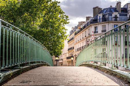 Paris, France - May 25, 2020: Iconic bridge of the Canal Saint-Martin in Paris France, a popular destination for Parisians, tourists and students on a beautiful Spring dayのeditorial素材