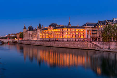 Paris, France - June 20, 2020: Pont Neuf at blue hour with reflection in Seine river in Parisのeditorial素材