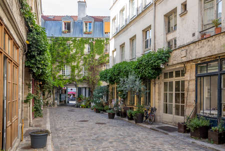 Paris, France - June 24, 2020: Passage Lhomme, one of the romantic courtyards in the East of Paris, France. These bucolic, unusual and hidden spots are delightful gems to exploreのeditorial素材