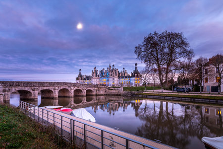 Chambord, France - December 26, 2020: Chambord castle with christmas trees and lights at blue hourのeditorial素材