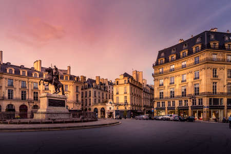 Paris, France - February 25, 2021: Beautiful buildings place des Victoires, typical parisian facades...