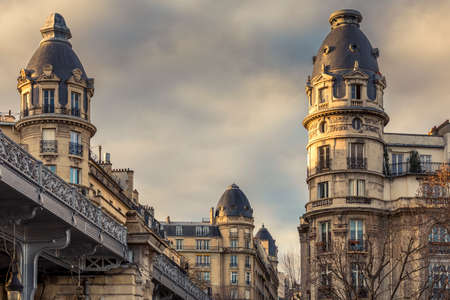 Paris, France - February 4, 2021: View of beautiful Haussmann buildings near Bir Hakeim bridge and Eiffel tower in Parisのeditorial素材