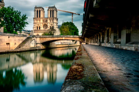 Paris, France - May 12, 2021: View of Notre Dame Cathedral from the banks of the Seine. A fire severely damaged the Cathedral in 2019のeditorial素材