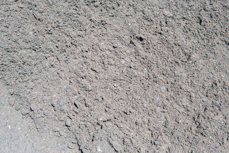 close-up shot of gray sand and pebbles ideal for use as background or textureの写真素材