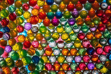 colored balls with cell shapes inside and illuminated that give a unique and mesmerizing effect.の写真素材