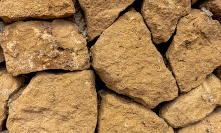 close-up shot of large irregular stone wall. background concept or texture