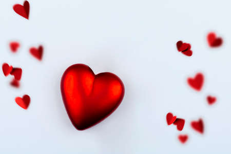 white background with red heart and little hearts out of focus, love concept, valentine's dayの写真素材