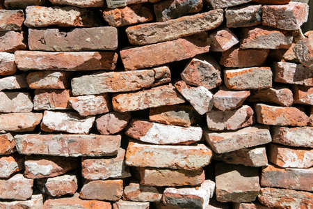 photo of stacked massive bricks. concept background or texture
