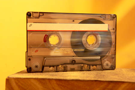 close-up shot of old transparent cassette tape with label on side bの写真素材