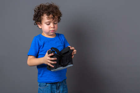 photo of curly-haired caucasian boy wearing virtual reality glassesの写真素材