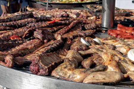 different types of meat grilling on giant grill special for events