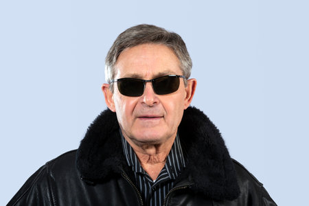 attractive elderly man with black leather jacket and sunglasses