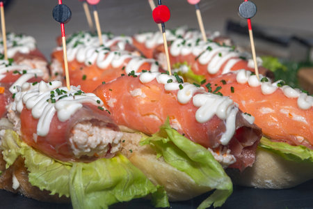 close-up of typical Spanish snack called pincho with salmonの写真素材