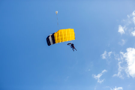 view of parachute descending with two people