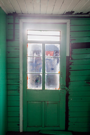 photograph of old door with glass in wooden car interiorの写真素材