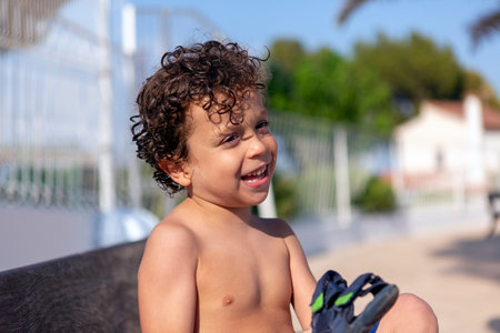 beautiful happy boy just out of the poolの写真素材