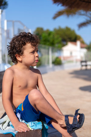 beautiful happy boy just out of the poolの写真素材