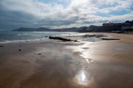 Beach at sunrise in the Spanish town of Comillas, Cantabria.の写真素材