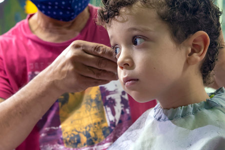 photo of beautiful boy in hairdressing salonの写真素材