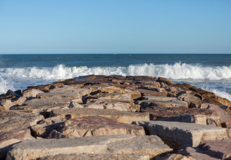 Close up view of breakwater rocks on sunny dayの写真素材