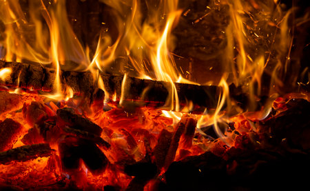detailed close-up of wooden planks burning in a bonfireの写真素材