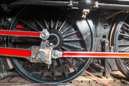 closeup wheel and gears of old trainの写真素材