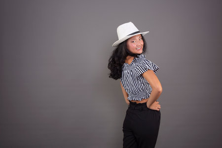 nice chinese woman in a white hat, isolated from the backgroundの写真素材