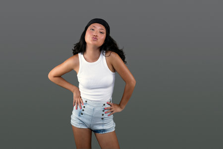 chinese woman with bandana isolated from the background and funny expressionの写真素材