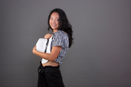young chinese woman wearing a white hat, isolated from the backgroundの写真素材